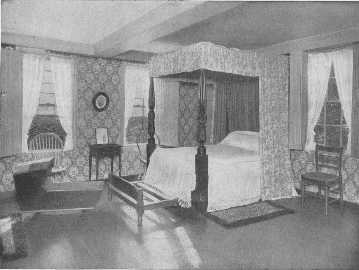 This fine well-curtained four poster, once the property
of Lafayette, the trundle-bed, cradle, chairs and table, are all
interesting, but the wallpaper appears to be of the ugly time of about
1880. Something more appropriate should be chosen.